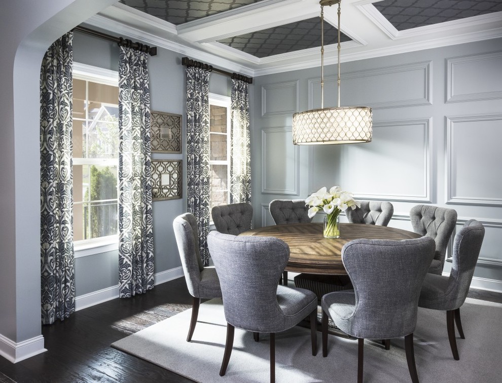 Photo of a traditional dining room in Charlotte with grey walls and dark hardwood flooring.