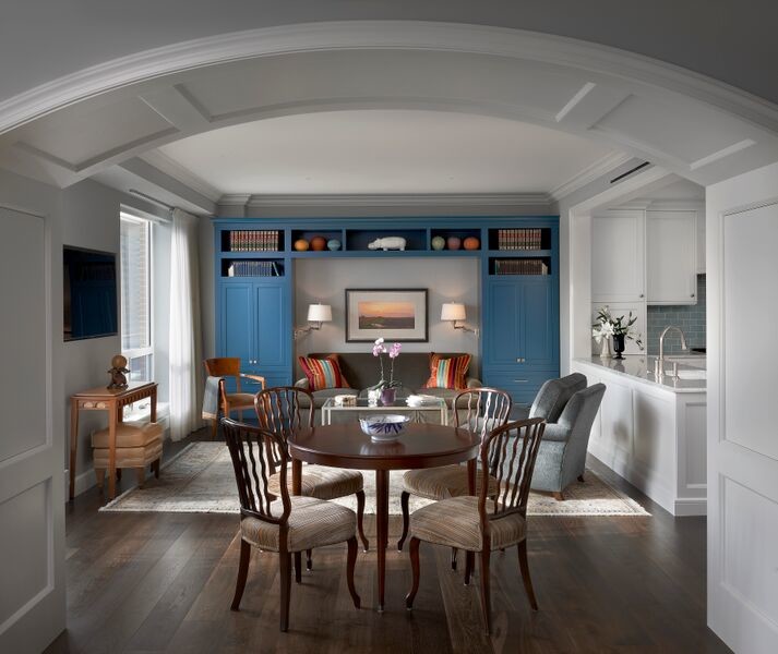 Photo of a traditional kitchen/dining room in Chicago with white walls and medium hardwood flooring.