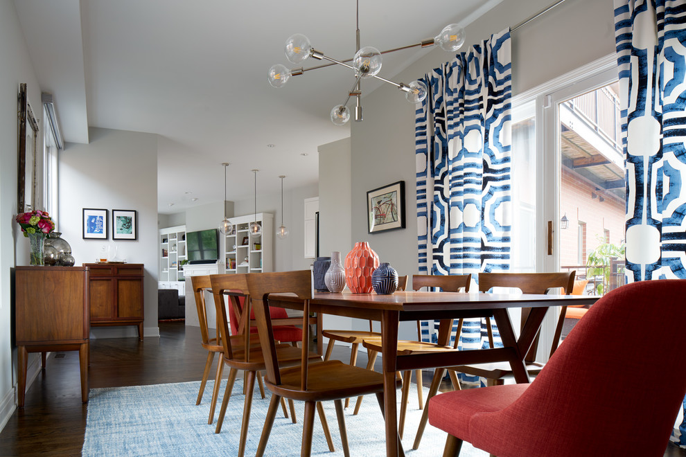 Photo of a large traditional enclosed dining room in Chicago with grey walls, dark hardwood flooring, no fireplace and brown floors.