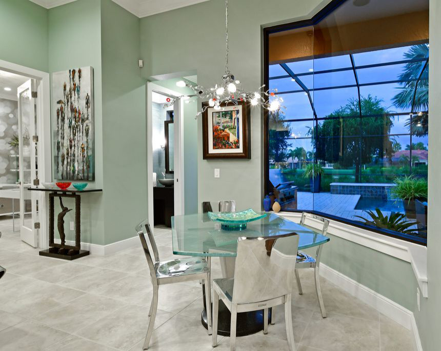 На фото: гостиная-столовая среднего размера в стиле модернизм с зелеными стенами, полом из керамогранита и серым полом без камина