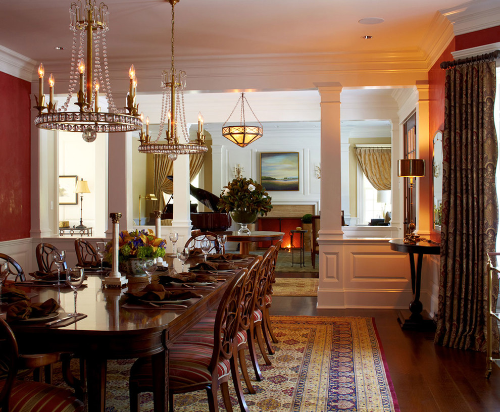 Inspiration for a dark wood floor dining room remodel in New York with red walls