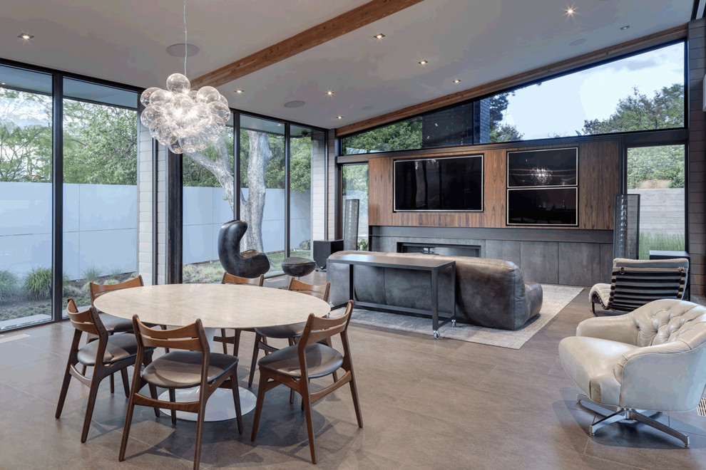 Medium sized modern open plan dining room in Dallas with ceramic flooring, a ribbon fireplace, a tiled fireplace surround and grey floors.