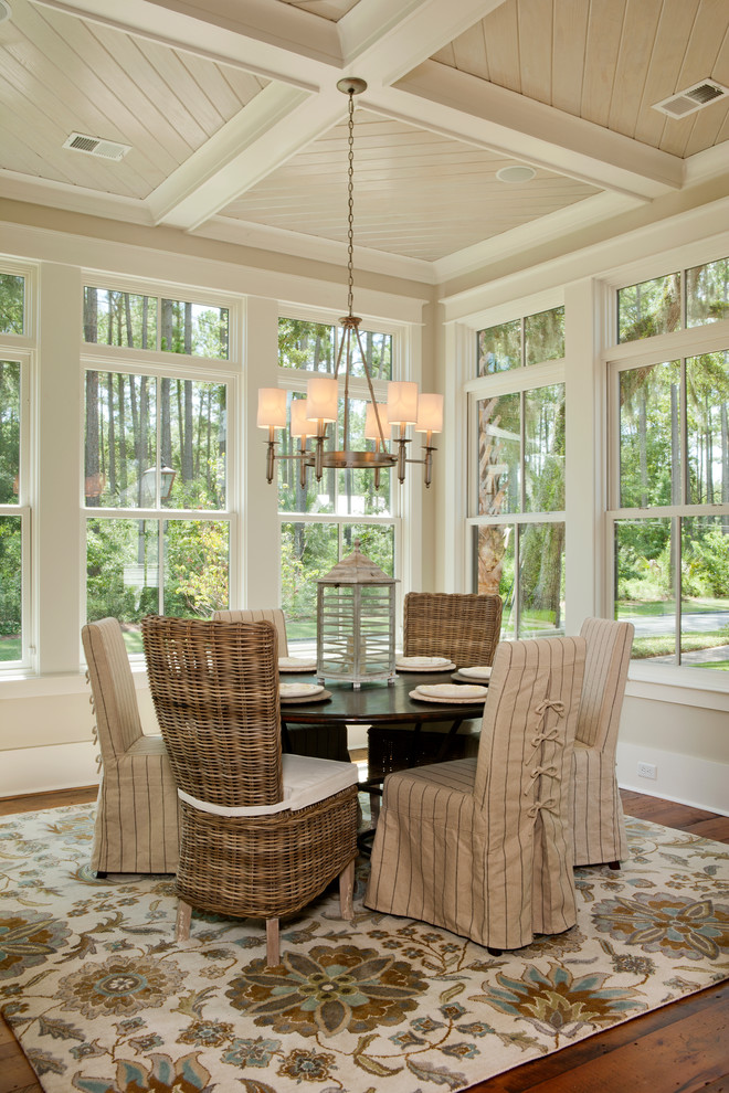 Inspiration for a beach style dining room in Charleston with beige walls, medium hardwood flooring and no fireplace.