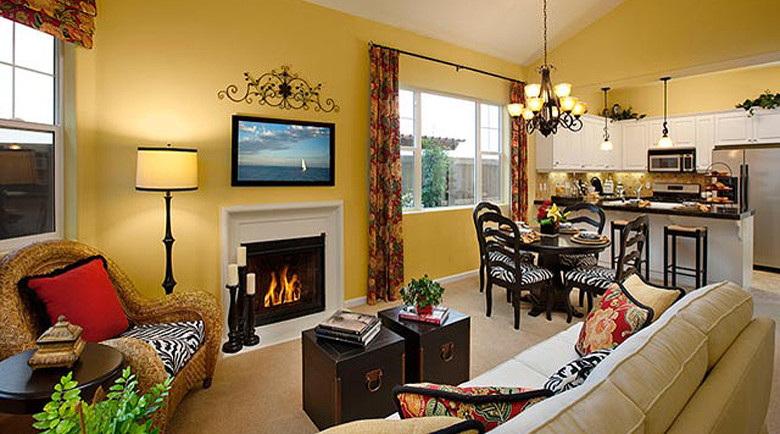 Huge tuscan carpeted great room photo in San Luis Obispo with yellow walls and a standard fireplace