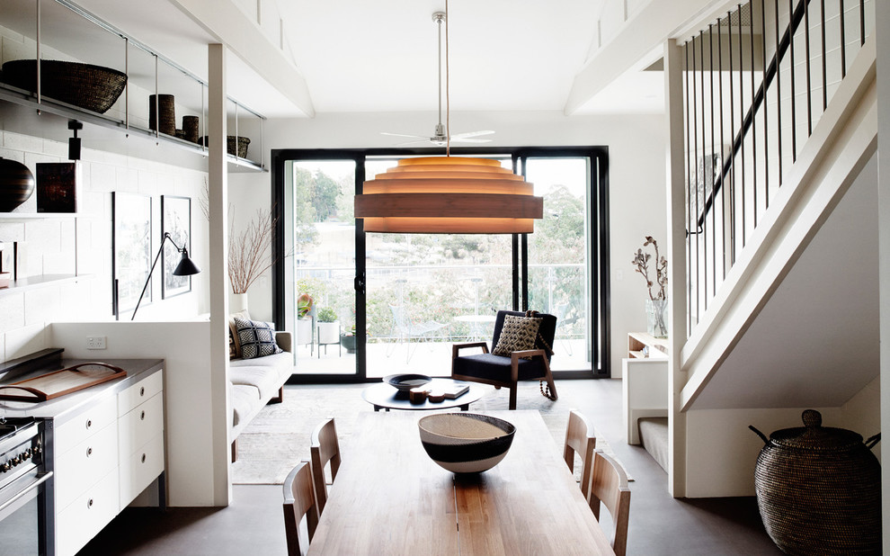Inspiration for a large contemporary medium tone wood floor great room remodel in Los Angeles with white walls