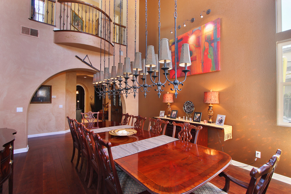 Inspiration for a bohemian enclosed dining room in San Diego with brown walls.