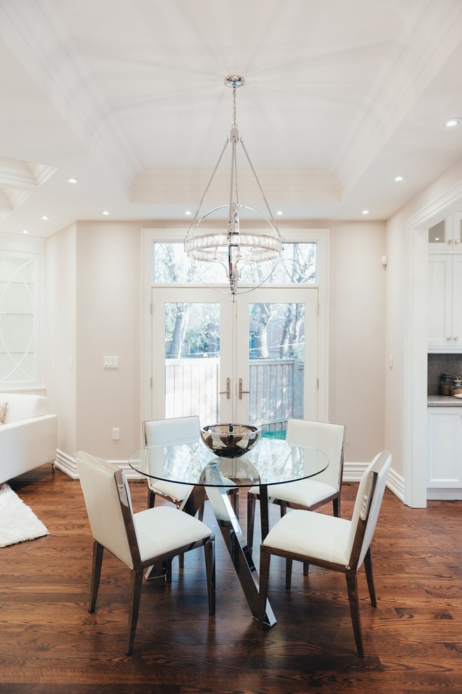 This is an example of a medium sized classic open plan dining room in Toronto with white walls, dark hardwood flooring, brown floors and no fireplace.