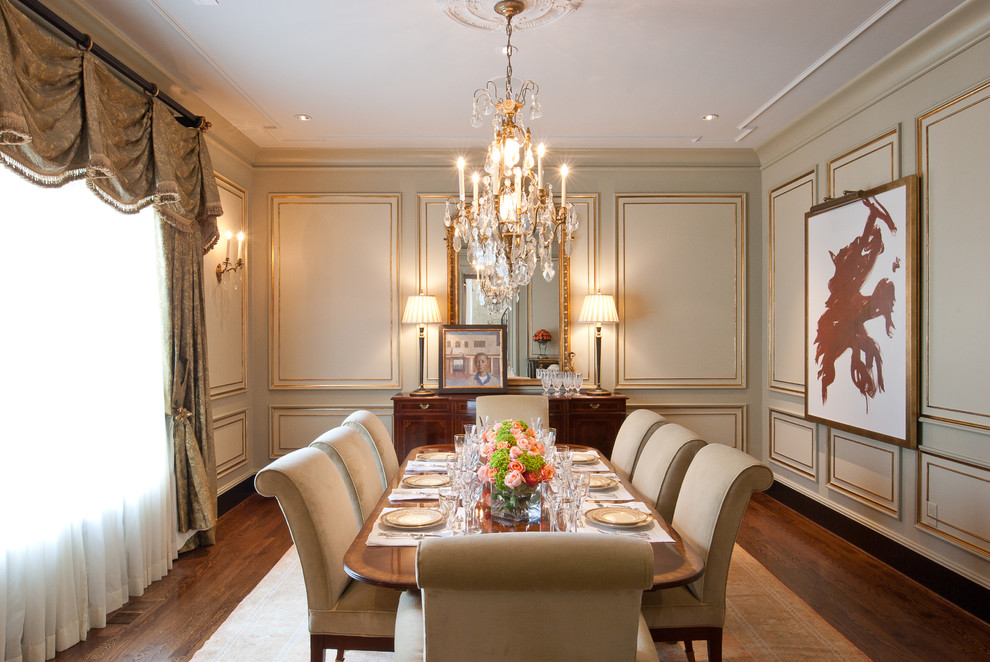 This is an example of a classic dining room in Nashville with beige walls and dark hardwood flooring.