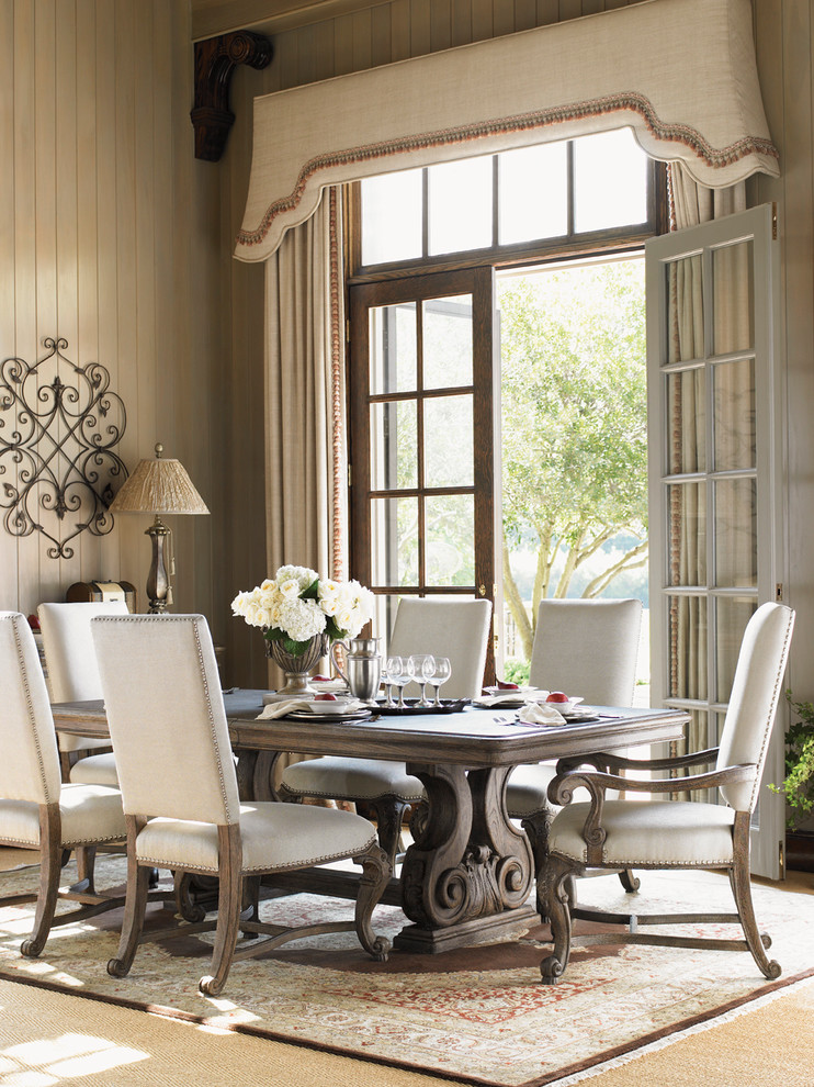 Example of a classic dining room design with beige walls