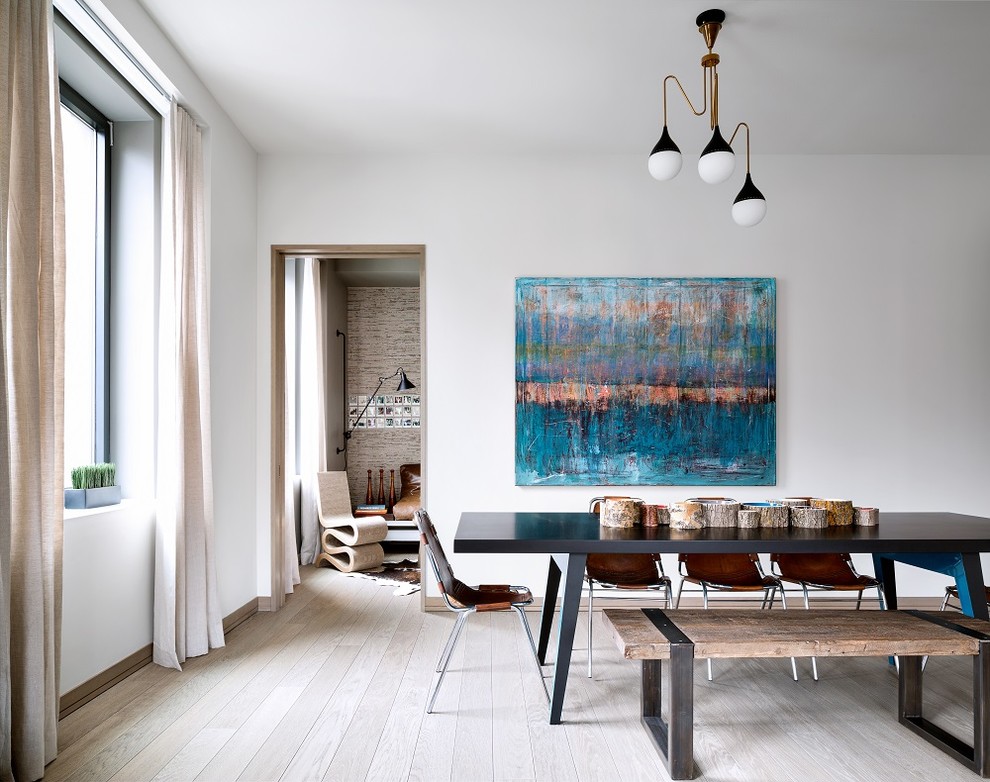 Inspiration for a contemporary light wood floor dining room remodel in Chicago with white walls