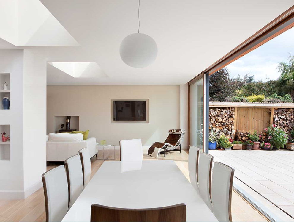 This is an example of a contemporary dining room in Dublin.
