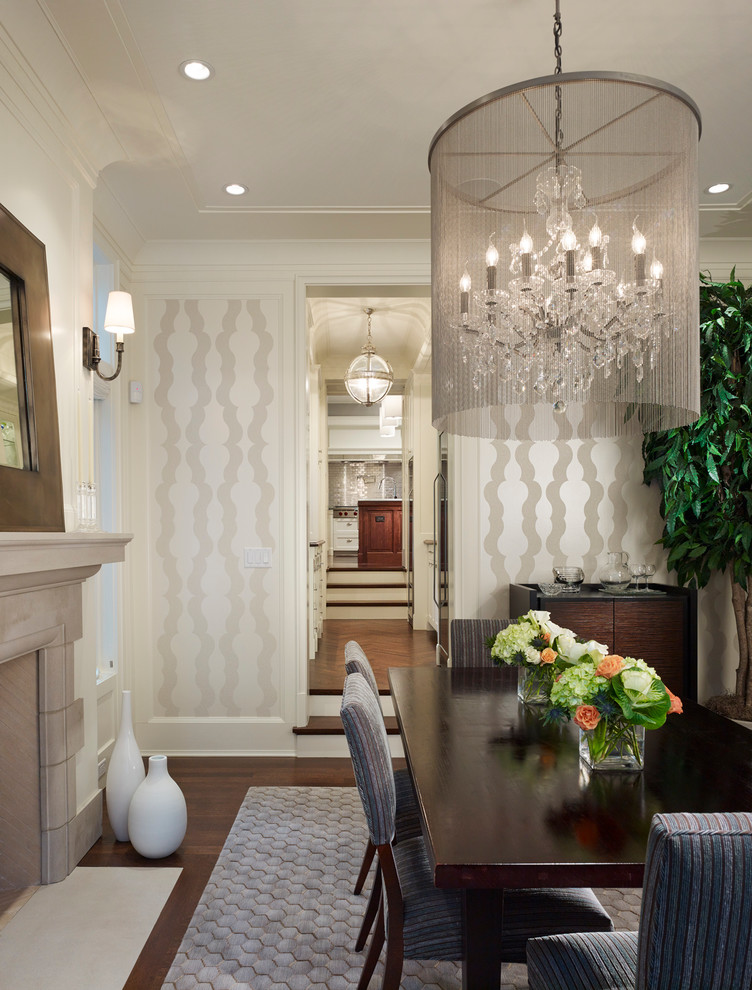 Example of a large classic dark wood floor enclosed dining room design in Chicago with white walls, a standard fireplace and a stone fireplace