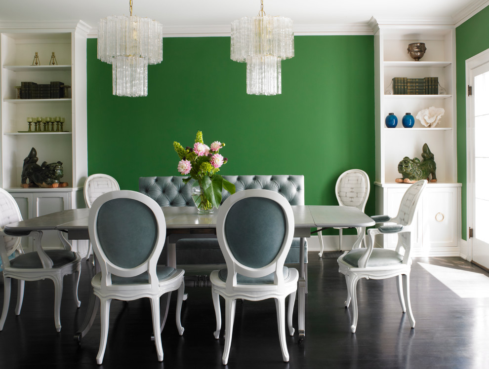 Inspiration for a traditional dining room in Los Angeles with green walls, dark hardwood flooring and no fireplace.