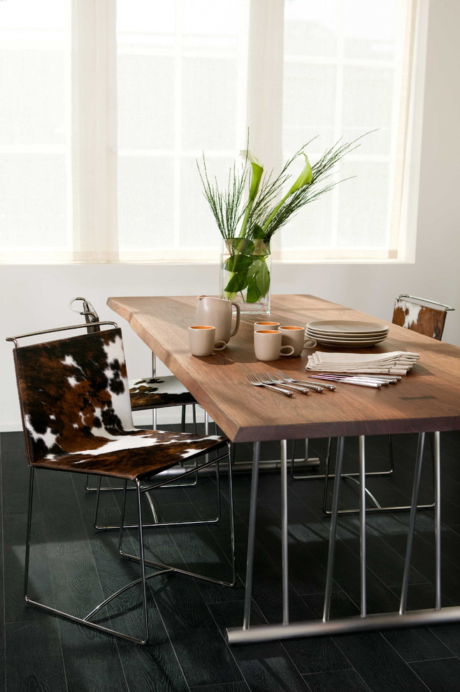 Inspiration for a contemporary black floor dining room remodel in San Francisco with white walls