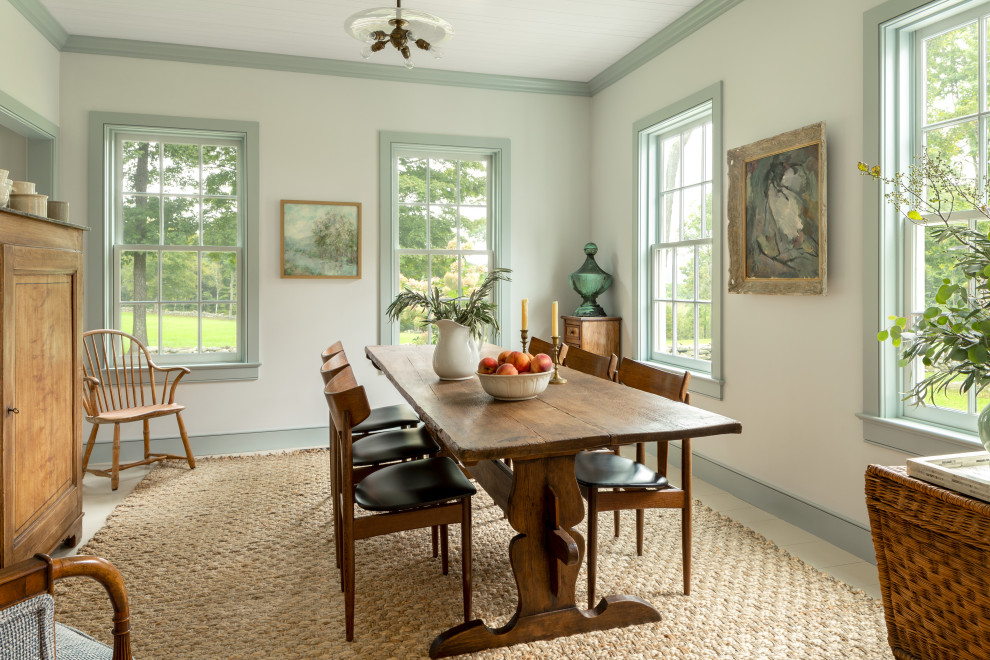 Design ideas for a farmhouse dining room in New York with white walls, light hardwood flooring and beige floors.