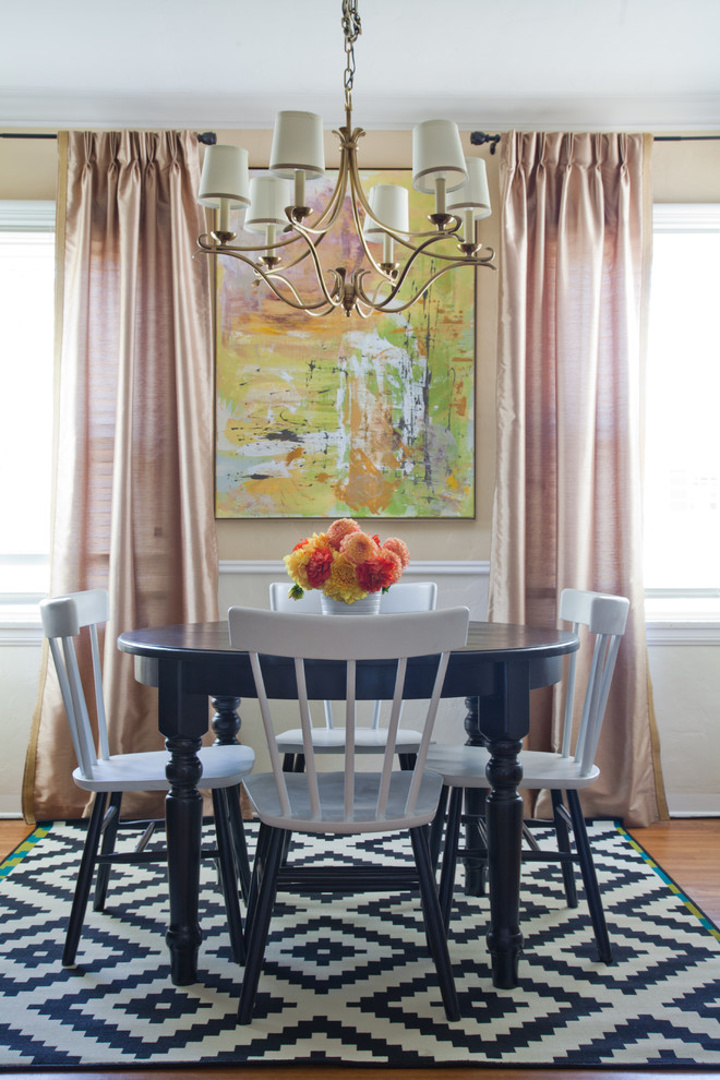 Photo of a traditional enclosed dining room in Other with beige walls and light hardwood flooring.