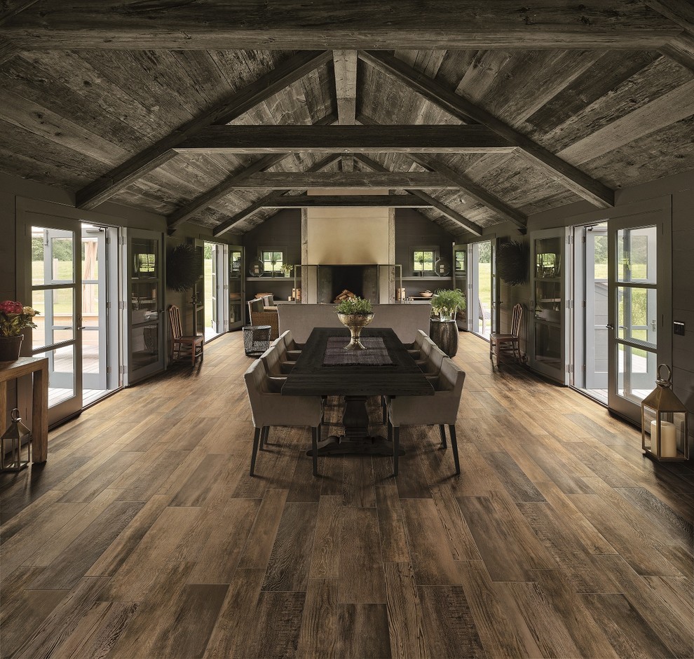 Inspiration for a medium sized rustic open plan dining room in Denver with grey walls.