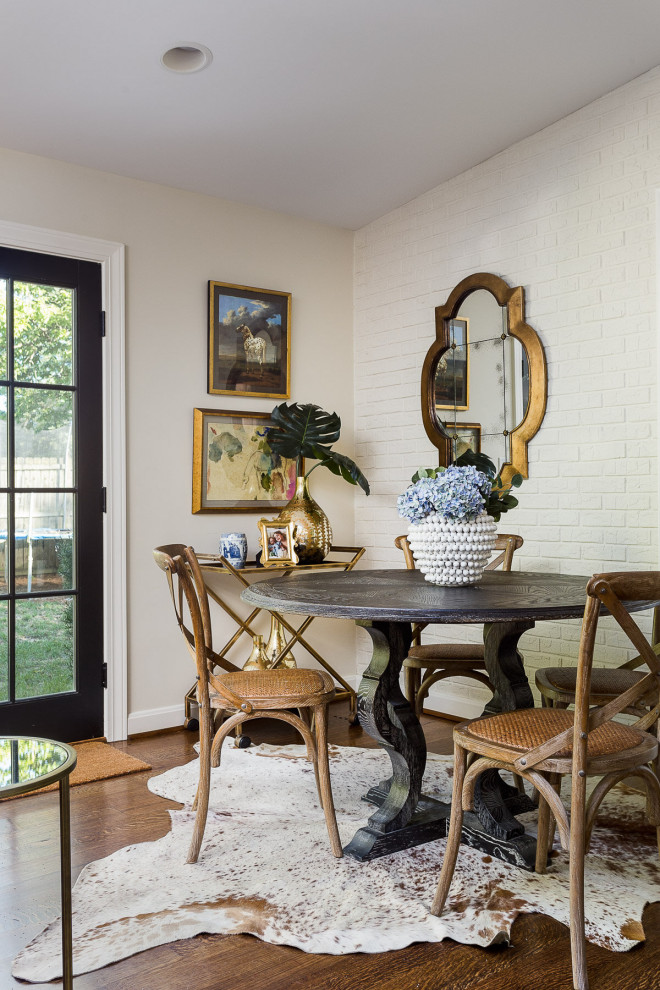Inspiration for a medium sized classic dining room in Louisville with beige walls, brown floors and brick walls.