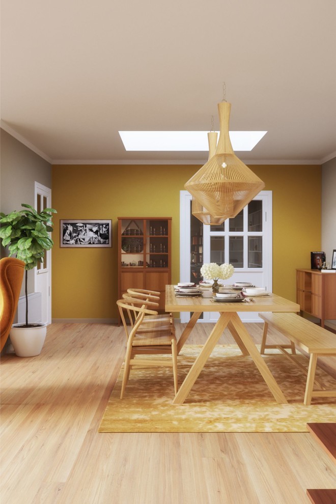 Idées déco pour une salle à manger éclectique fermée et de taille moyenne avec un mur beige, parquet peint, cheminée suspendue, un manteau de cheminée en métal et un sol beige.