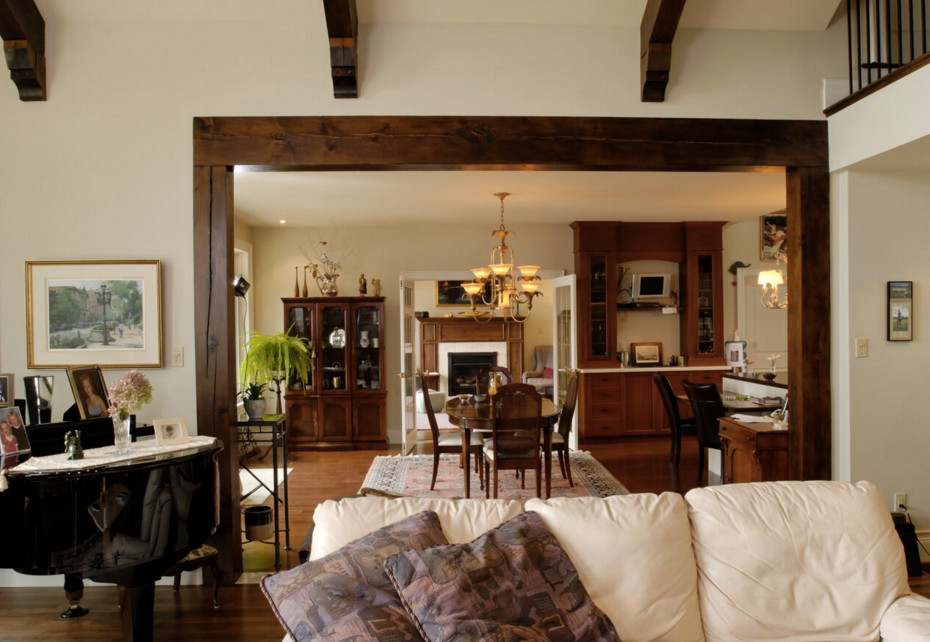 Example of a large arts and crafts medium tone wood floor great room design in Boston with beige walls and no fireplace
