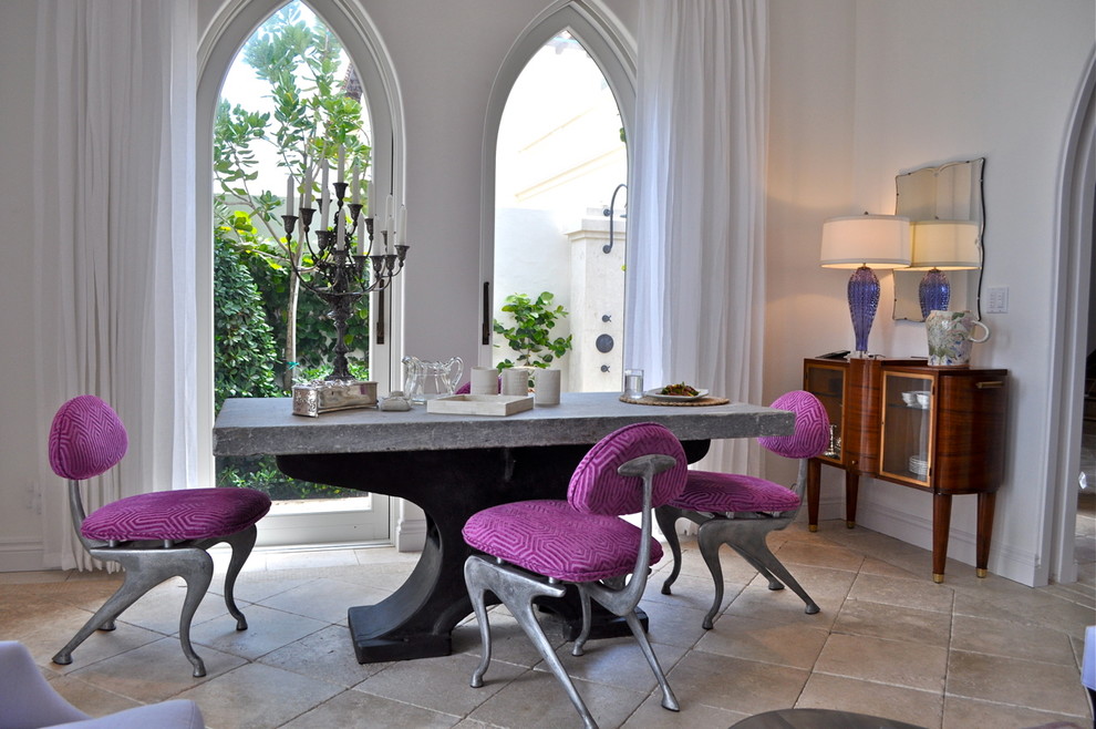 Enclosed dining room - large eclectic limestone floor enclosed dining room idea in Miami with white walls