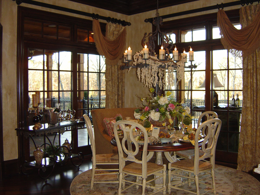 This is an example of a medium sized traditional enclosed dining room in Atlanta with beige walls and dark hardwood flooring.