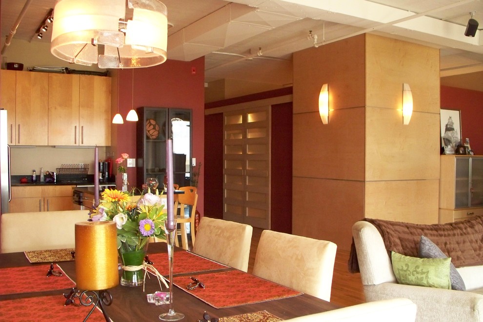 Inspiration for a contemporary light wood floor dining room remodel in Boston with brown walls