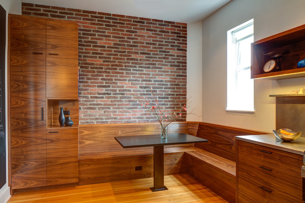 Contemporary dining room in Portland with medium hardwood flooring.