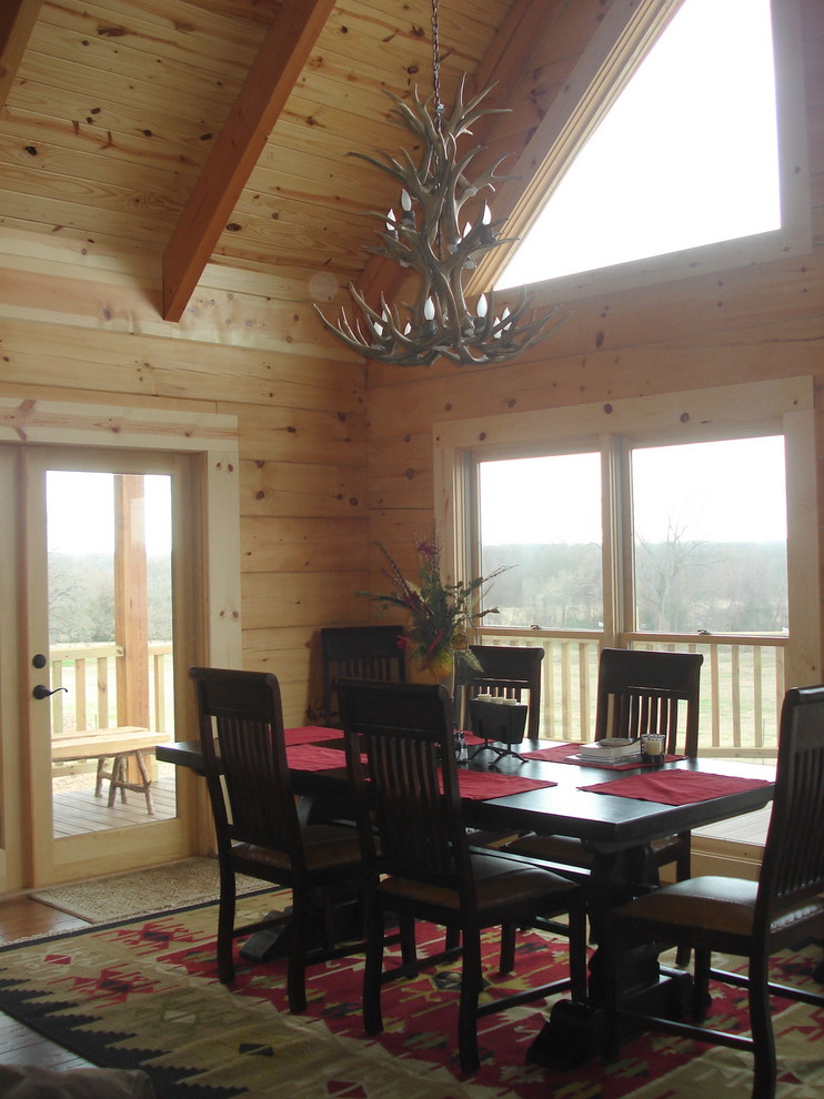 Example of a mountain style dining room design in Houston