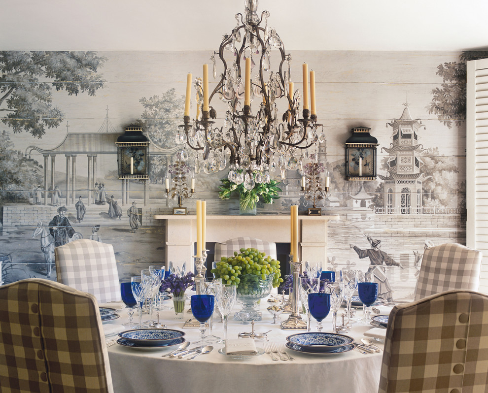 Dining room - traditional dining room idea in London with multicolored walls and a standard fireplace