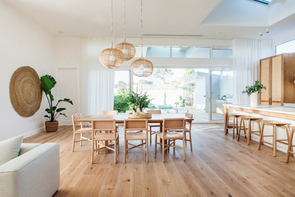 Design ideas for a coastal dining room in Central Coast.