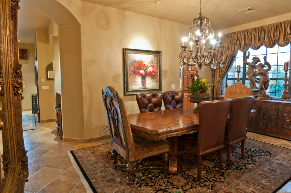 Example of a tuscan dining room design in Phoenix