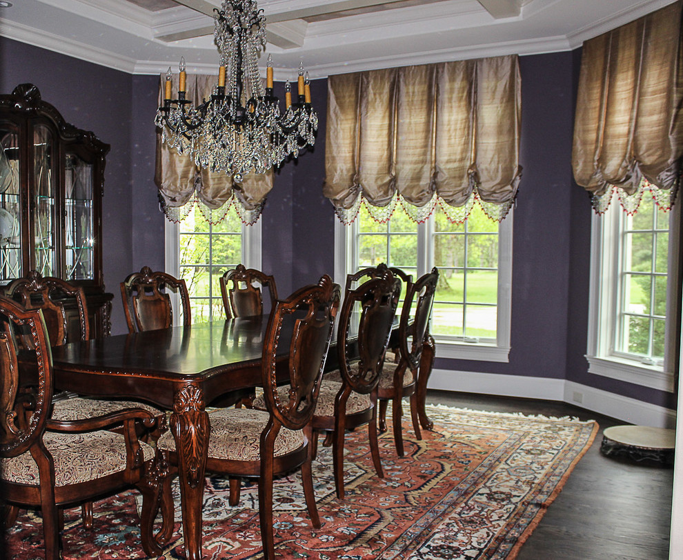 This is an example of a large mediterranean enclosed dining room in Cincinnati with purple walls, dark hardwood flooring and no fireplace.