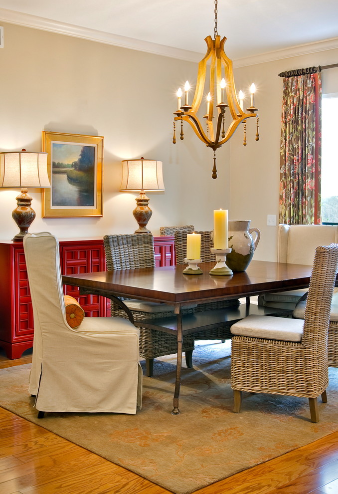 Traditional dining room in Charleston with beige walls and feature lighting.