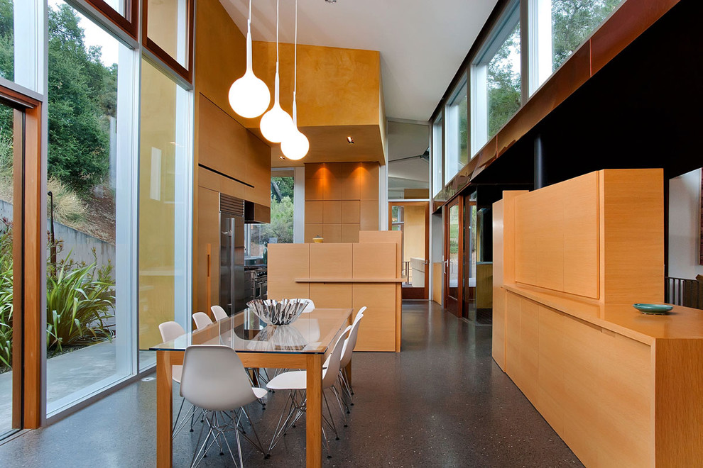Contemporary dining room in San Francisco with concrete flooring.