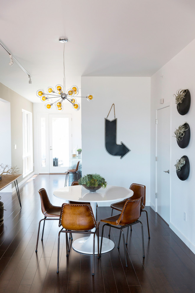 Dining room - coastal dark wood floor dining room idea in San Francisco with white walls