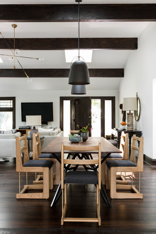 Photo of a traditional open plan dining room in Los Angeles with white walls and dark hardwood flooring.