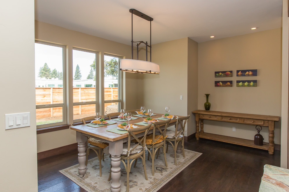 Mid-sized elegant dark wood floor kitchen/dining room combo photo in Portland with beige walls