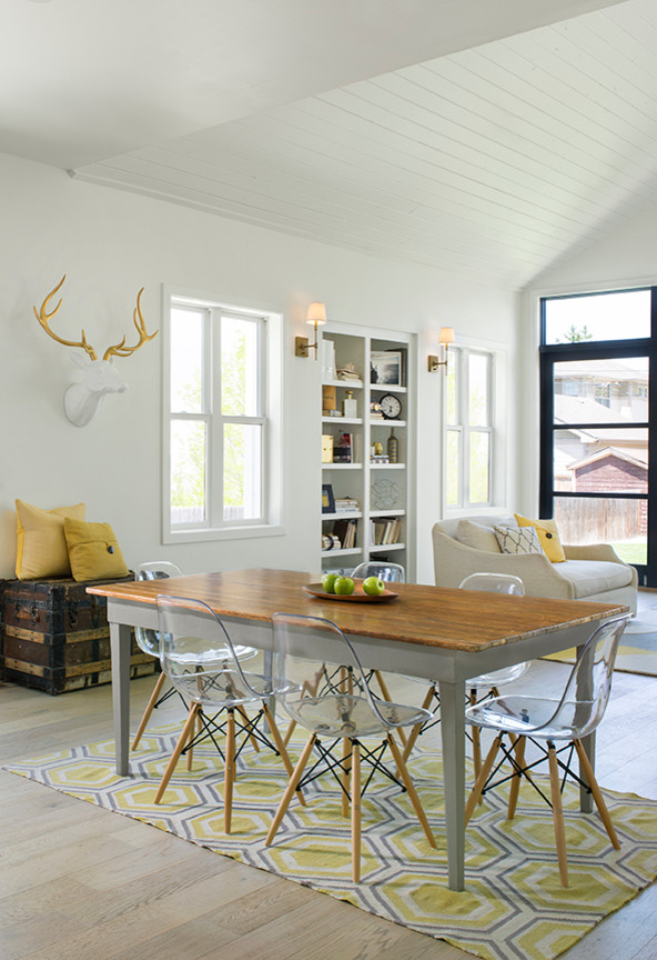Medium sized farmhouse open plan dining room in Denver with white walls and light hardwood flooring.
