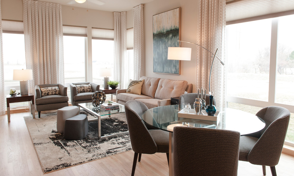 Example of a small trendy light wood floor great room design in Denver with white walls and no fireplace