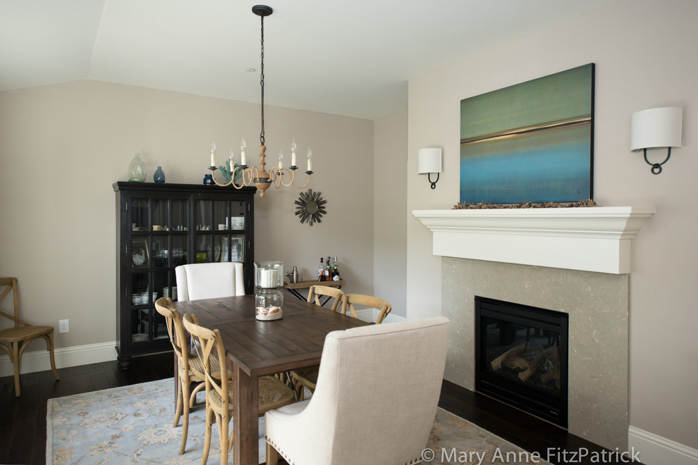 Inspiration for a medium sized beach style enclosed dining room in San Francisco with beige walls and a stone fireplace surround.