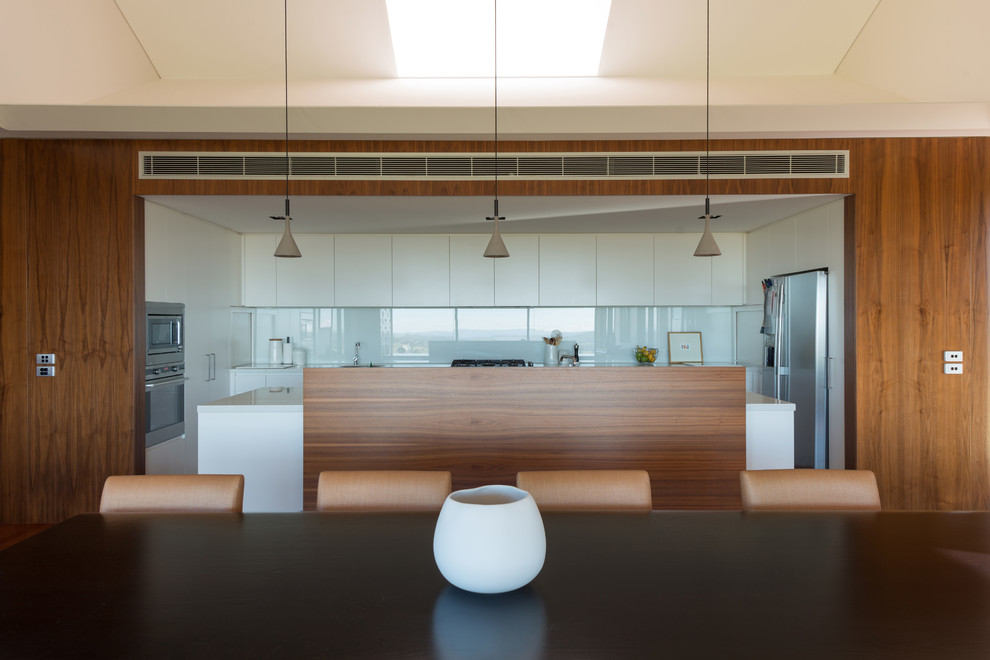 This is an example of a contemporary dining room in Sydney.