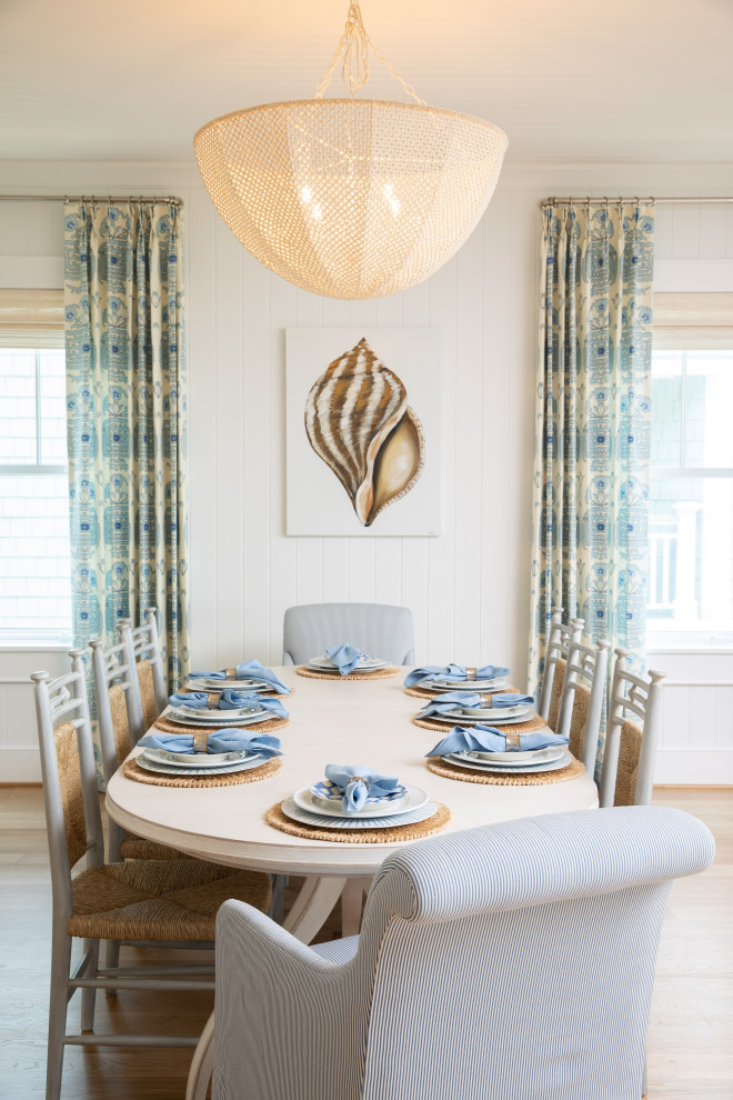 Dining room - coastal dining room idea in Other