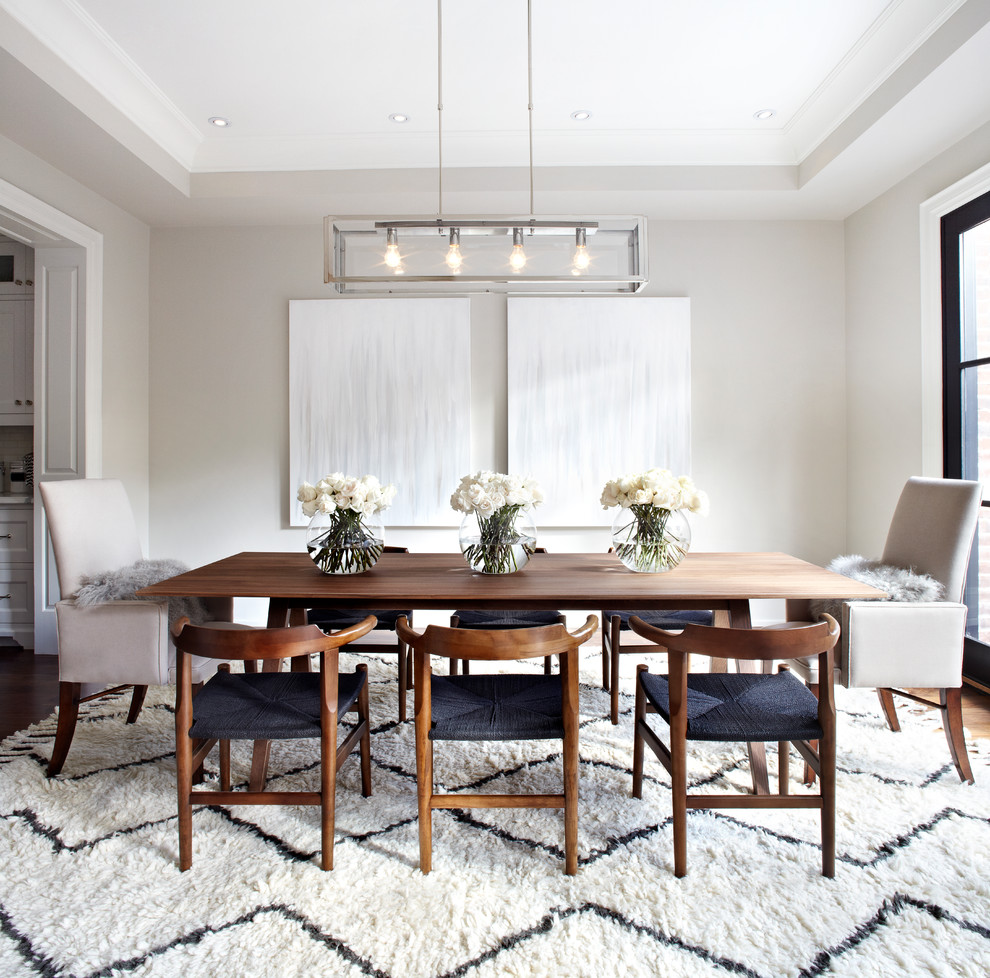 Design ideas for a traditional enclosed dining room in Toronto with grey walls.