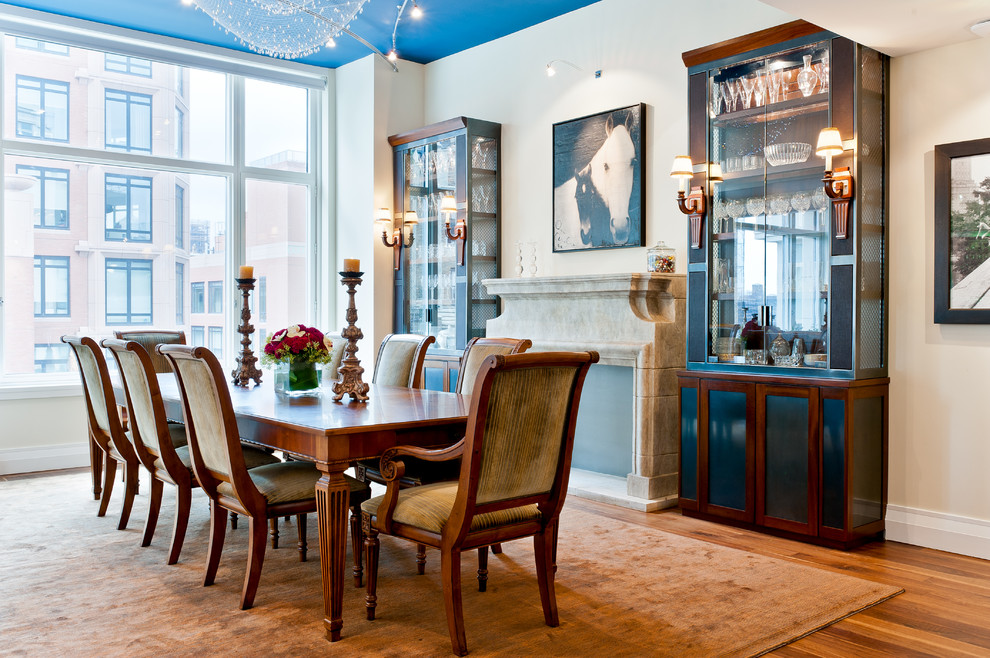 Inspiration for a traditional dining room in New York with white walls and medium hardwood flooring.
