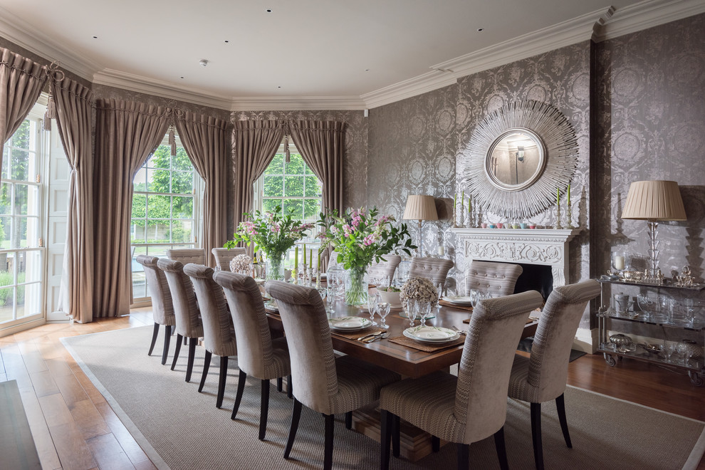 Example of a classic dark wood floor and brown floor dining room design in Cornwall with gray walls