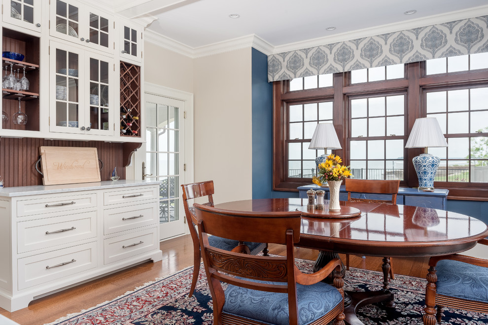 Photo of a large coastal dining room in Bridgeport with medium hardwood flooring, blue walls and no fireplace.
