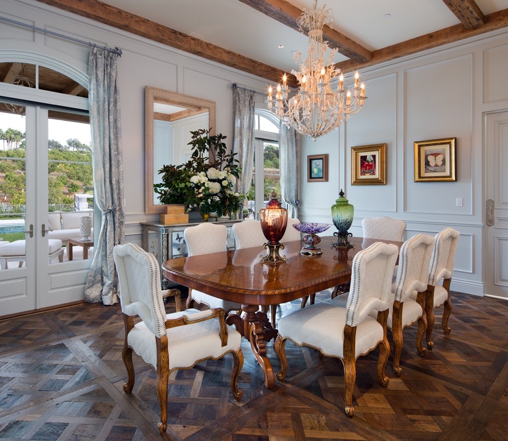 Photo of a large mediterranean enclosed dining room in San Diego with white walls, dark hardwood flooring, no fireplace and brown floors.