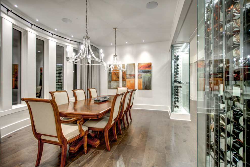 Large trendy medium tone wood floor and brown floor enclosed dining room photo in Calgary with white walls