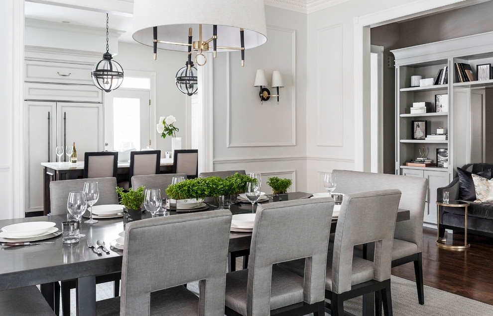 Inspiration for a medium sized classic enclosed dining room in Montreal with white walls and dark hardwood flooring.